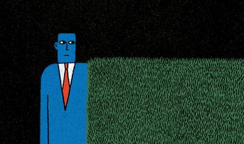man next to hedge